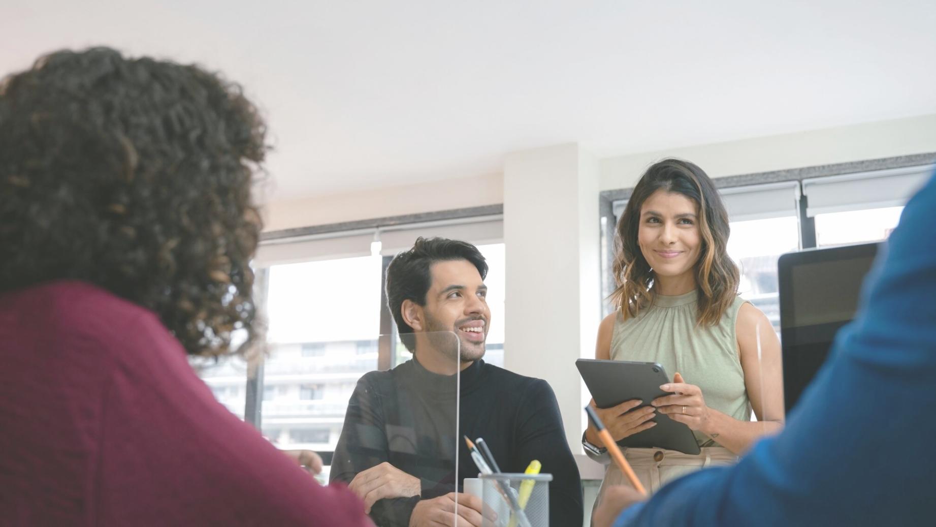 Team collaboration session reviewing financial data and user feedback